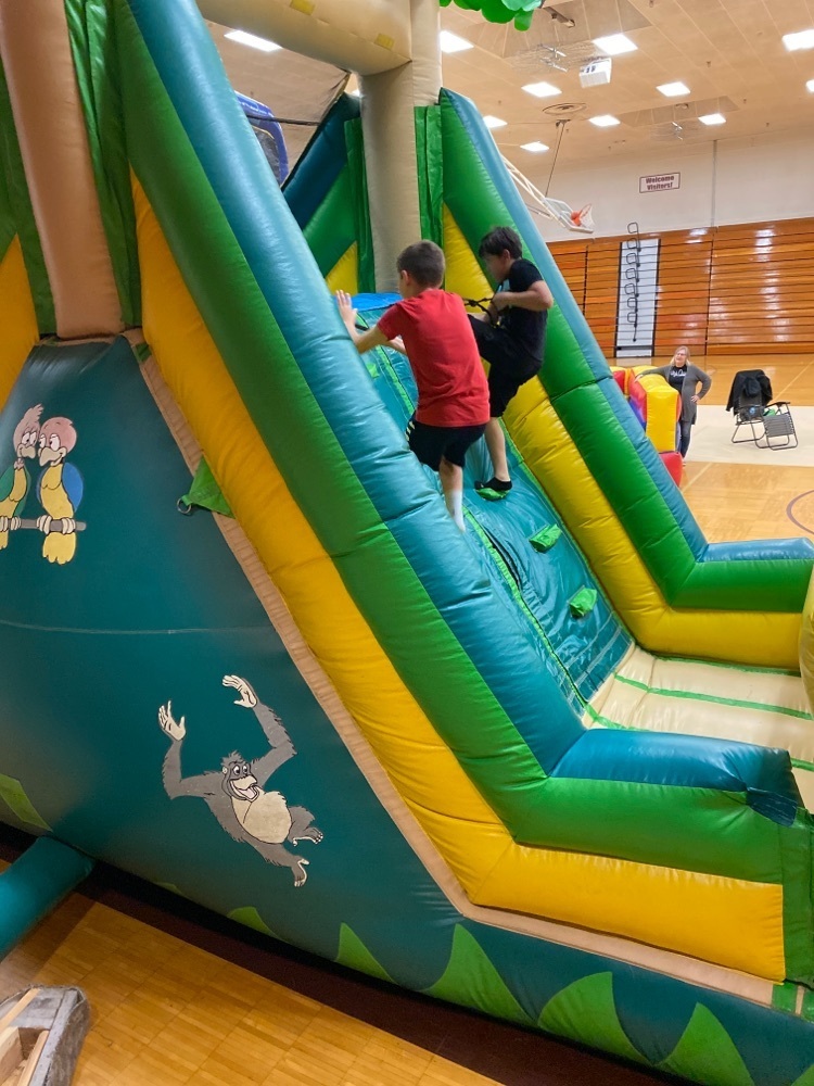 5th and 6th graders enjoying the inflatables who met their AR goals all 4 quarters