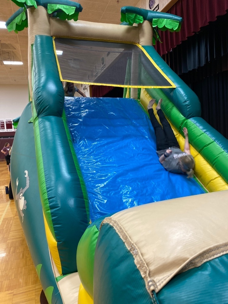 3rd and 4th graders enjoying the inflatables