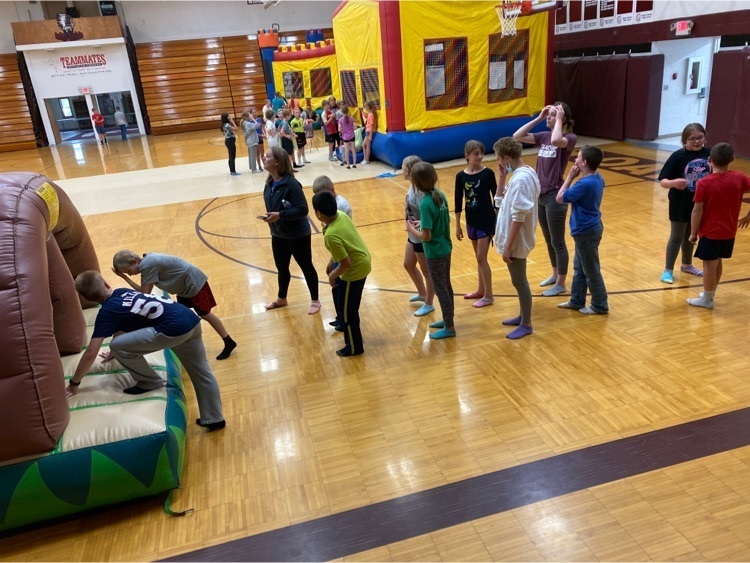 5th and 6th graders enjoying the inflatables
