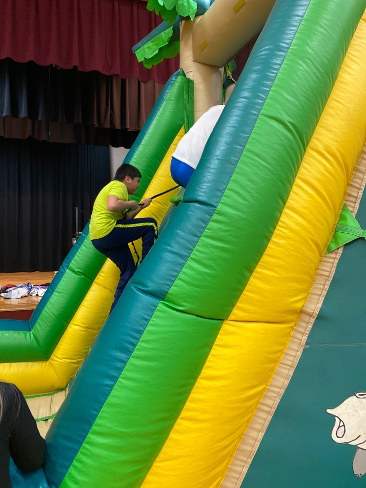 5th and 6th graders enjoying the inflatables