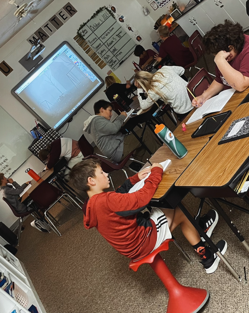 6th graders writing on the 1st day of October.